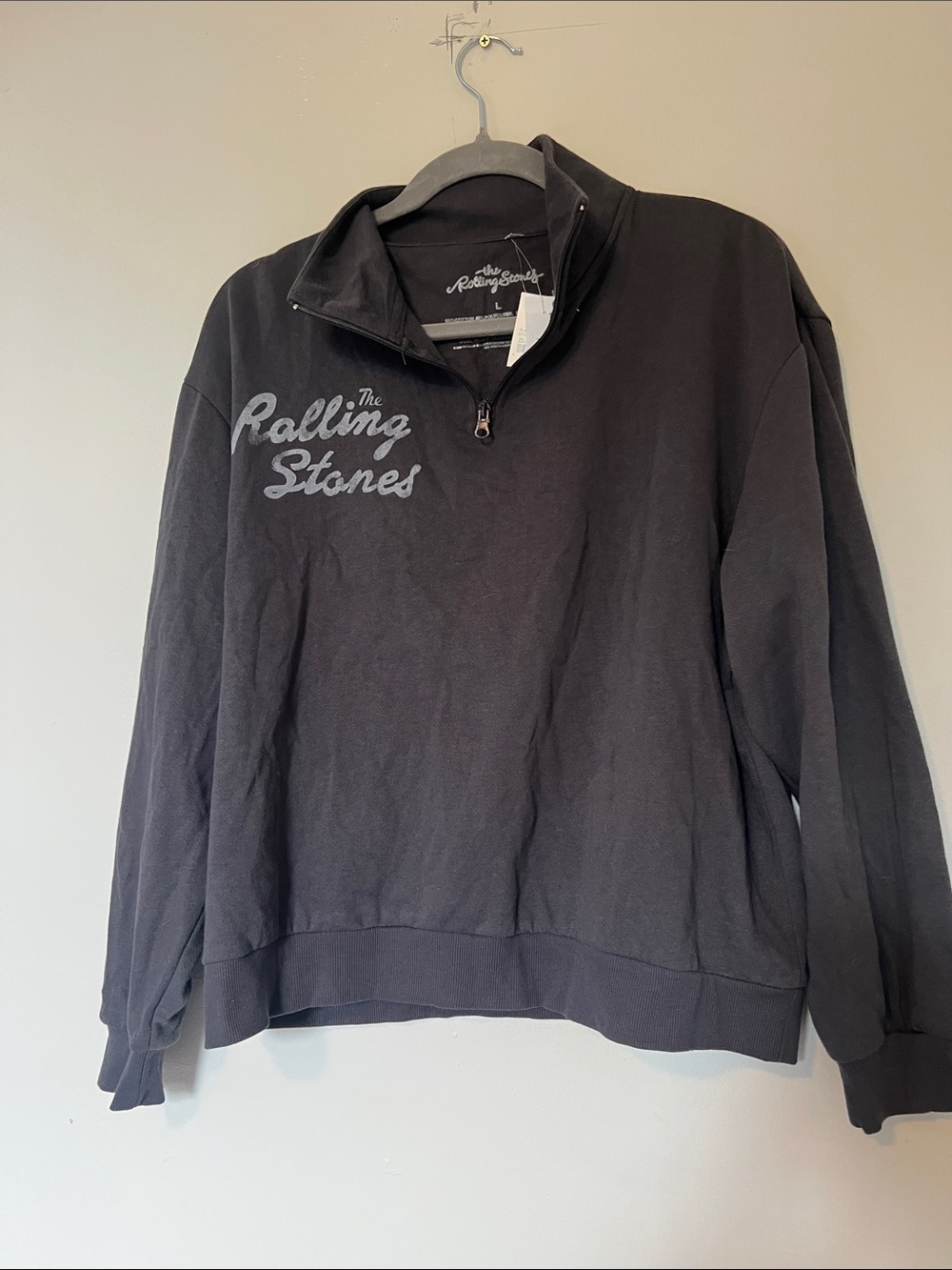 the Rolling Stones Black Half-Zip Sweatshirt with Script Logo